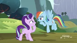 Size: 1334x750 | Tagged: safe, derpibooru import, screencap, rainbow dash, starlight glimmer, pegasus, pony, unicorn, no second prances, discovery family logo, duo, female, flying, grin, lidded eyes, looking at each other, mare, nervous, nervous grin, sheepish grin, smiling, spread wings, unimpressed, wings