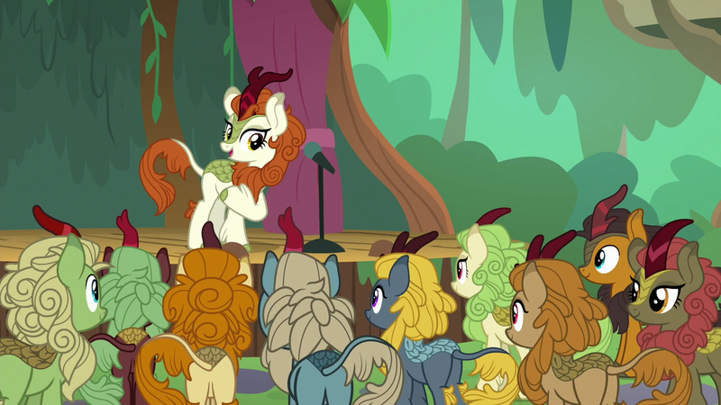 Size: 1280x720 | Tagged: autumn afternoon, autumn blaze, background kirin, butt, cinder glow, crowd, derpibooru import, female, fern flare, forest fall, kirin, male, maple brown, microphone, plot, pumpkin smoke, safe, screencap, sounds of silence, sparkling brook, spoiler:s08, spring glow, stage, summer flare, winter flame