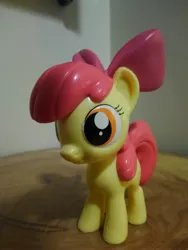 Size: 3120x4160 | Tagged: safe, derpibooru import, photographer:apex soundwave, apple bloom, earth pony, pony, bow, collectible, female, filly, funko, irl, mare, photo, small, solo, toy, vinyl collectible, vinyl figure