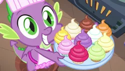 Size: 1280x720 | Tagged: safe, derpibooru import, screencap, spike, dragon, father knows beast, apron, clothes, cupcake, cute, food, hopeful, looking up, male, naked apron, smiling, solo, tray