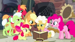 Size: 1440x809 | Tagged: safe, derpibooru import, screencap, apple bloom, applejack, big macintosh, goldie delicious, granny smith, pinkie pie, earth pony, pony, pinkie apple pie, apple family, book, family, female, filly, foal, gramophone, male, mare, prone, reading, spider web, stallion