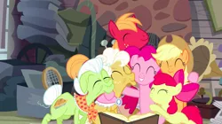 Size: 1440x808 | Tagged: safe, derpibooru import, screencap, apple bloom, applejack, big macintosh, goldie delicious, granny smith, pinkie pie, earth pony, pony, pinkie apple pie, apple family, book, elderly, eyes closed, family, female, filly, foal, group hug, hug, male, mare, stallion