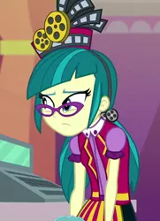 Size: 780x1077 | Tagged: safe, derpibooru import, screencap, juniper montage, equestria girls, mirror magic, spoiler:eqg specials, apron, baubles, cash register, cinema, clothes, cropped, female, glasses, hair tie, hat, mirror, pigtails, poofy shoulders, shirt, skirt, solo, standing, twintails, uniform