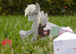 Size: 1500x1066 | Tagged: safe, artist:foxxy-arts, derpibooru import, derpy hooves, pegasus, pony, bag, craft, derpy day, derpy day 2012, felt, grass, holding, irl, letter, mailmare, one eye closed, photo, ponies in real life, saddle bag, solo, spread wings, traditional art, wings, wink