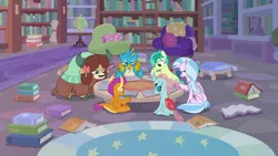 Size: 1280x720 | Tagged: safe, derpibooru import, screencap, gallus, ocellus, sandbar, silverstream, smolder, yona, changedling, changeling, classical hippogriff, dragon, earth pony, gryphon, hippogriff, pony, yak, what lies beneath, book, bookshelf, bow, chair, cloven hooves, colored hooves, dragoness, female, globe, hair bow, library, male, monkey swings, sitting, student six, studying, table, tail, teenager