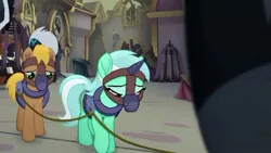 Size: 613x345 | Tagged: safe, derpibooru import, screencap, lyra heartstrings, songbird serenade, earth pony, pony, unicorn, my little pony: the movie, bound together, cage, collar, cropped, female, harness, horn, horn cap, magic suppression, male, mare, muzzle, sad, slavery, stallion, tack