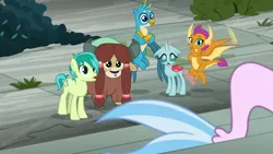Size: 1280x720 | Tagged: safe, derpibooru import, screencap, gallus, ocellus, sandbar, silverstream, smolder, yona, changedling, changeling, dragon, earth pony, gryphon, pony, seapony (g4), yak, school daze, bow, cloven hooves, colored hooves, crossed arms, dragoness, female, flying, hair bow, male, monkey swings, paws, student six, tail, teenager, wings