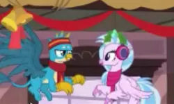 Size: 1435x859 | Tagged: safe, derpibooru import, screencap, gallus, silverstream, classical hippogriff, gryphon, hippogriff, best gift ever, christmas decoration, clothes, cropped, duo, earmuffs, eye contact, female, flying, headband, looking at each other, low quality, male, mistletoe, needs more jpeg, ponyville, scarf, shipping fuel, train station