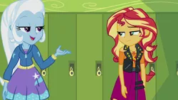 Size: 1920x1080 | Tagged: safe, derpibooru import, screencap, sunset shimmer, trixie, equestria girls, equestria girls series, forgotten friendship, geode of empathy, lockers, magical geodes, raised arm, raised eyebrow, smiling, smirk