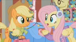 Size: 1350x752 | Tagged: applejack, best gift ever, clothes, derpibooru import, discovery family logo, earmuffs, flim, fluttershy, glasses, holly the hearths warmer doll, safe, screencap, shopping bags, sweater, table