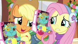 Size: 1280x720 | Tagged: applejack, best gift ever, derpibooru import, duo, earmuffs, fluttershy, holly the hearths warmer doll, safe, screencap, yay