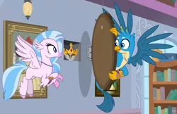 Size: 1502x976 | Tagged: safe, derpibooru import, screencap, gallus, silverstream, classical hippogriff, gryphon, hippogriff, a matter of principals, duo, female, flying, male, scavenger hunt, spread wings, wings