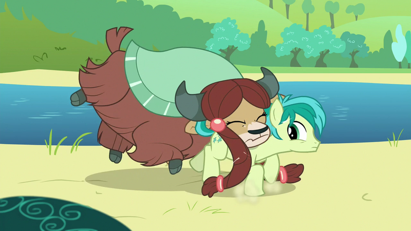 Size: 1280x720 | Tagged: safe, derpibooru import, screencap, sandbar, yona, earth pony, pony, yak, school daze, bow, cloven hooves, eyes closed, female, hair bow, male, monkey swings, teenager