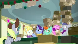 Size: 1438x808 | Tagged: safe, derpibooru import, screencap, derpy hooves, november rain, peppermint goldylinks, slate sentiments, strawberry scoop, summer breeze, earth pony, pegasus, pony, unicorn, best gift ever, background pony, box, boxes, clothes, desk, discovery family logo, earmuffs, female, friendship student, hair bun, hat, mailmare, mailmare hat, male, mare, package, post office, scarf, stack, stallion