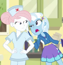 Size: 1040x1079 | Tagged: safe, derpibooru import, screencap, nurse redheart, trixie, equestria girls, equestria girls series, forgotten friendship, cropped, duo, female, hands on hip, hat, nurse, nurse hat, nurse outfit, scrubs