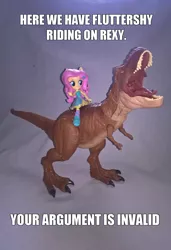 Size: 1833x2683 | Tagged: safe, artist:edhelistar, derpibooru import, fluttershy, dinosaur, tyrannosaurus rex, equestria girls, badass, caption, crossover, doll, equestria girls minis, fall formal outfits, flutterbadass, humans riding dinosaurs, image macro, irl, jurassic park, jurassic world, knee-high boots, meme, photo, ponied up, rexy, riding, roar, text, toy, your argument is invalid