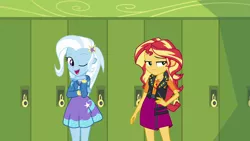 Size: 1920x1080 | Tagged: safe, derpibooru import, screencap, sunset shimmer, trixie, equestria girls, equestria girls series, forgotten friendship, canterlot high, clothes, cute, diatrixes, duo, geode of empathy, hallway, hoodie, leather vest, lockers, looking at you, magical geodes, one eye closed, open mouth, skirt, smiling, wink