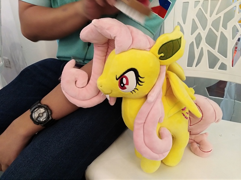 Size: 4032x3016 | Tagged: safe, derpibooru import, photographer:horsesplease, fluttershy, bat pony, human, bat ponified, brushie, comb, flutterbat, malaysia, plushie, race swap, smiling, smirk, the friendship express