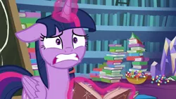 Size: 1280x720 | Tagged: alicorn, best gift ever, book, bookshelf, candy, candy cane, chalkboard, derpibooru import, floppy ears, food, glowing horn, horn, levitation, magic, safe, screencap, solo, telekinesis, twilight sparkle, twilight sparkle (alicorn), worried