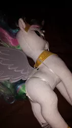 Size: 1836x3264 | Tagged: suggestive, derpibooru import, princess celestia, alicorn, pony, bondage, butt, female, femsub, horn, irl, jewelry, mare, merch sexploitation, peytral, photo, plushie, ribbon, shibari, simple background, solo, solo female, sublestia, submissive, sunbutt, tiara, tied, tied up, toy, wings