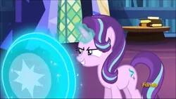 Size: 1280x720 | Tagged: safe, derpibooru import, screencap, starlight glimmer, pony, unicorn, every little thing she does, book, discovery family logo, female, glowing horn, horn, magic, mare, shield