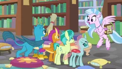 Size: 1280x720 | Tagged: safe, derpibooru import, screencap, gallus, ocellus, sandbar, silverstream, smolder, changedling, changeling, classical hippogriff, dragon, earth pony, gryphon, hippogriff, pony, what lies beneath, book, bookshelf, dragoness, female, library, male, pillow, scroll, teenager