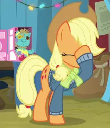 Size: 396x460 | Tagged: safe, derpibooru import, screencap, applejack, holly the hearths warmer doll, earth pony, pony, best gift ever, cropped, eyes closed, facehoof, female, mare, raised hoof, solo