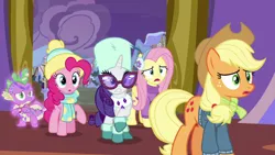 Size: 1280x720 | Tagged: safe, derpibooru import, screencap, applejack, fluttershy, pinkie pie, rarity, spike, dragon, earth pony, pegasus, pony, unicorn, best gift ever, bedazzled, clothes, earmuffs, glasses, hat, male, raised hoof, scarf, sweater, winged spike