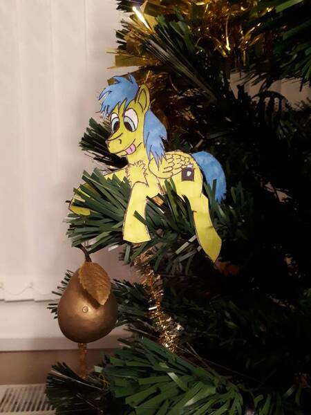 Size: 864x1152 | Tagged: safe, artist:rapidsnap, derpibooru import, oc, oc:rapidsnap, christmas, christmas tree, craft, food, holiday, licking, licking lips, papercraft, pear, perching, puppet, tongue out, traditional art, tree, tree branch