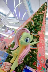 Size: 683x1024 | Tagged: christmas, christmas tree, creepy, derpibooru import, fluttershy, holiday, irl, nightmare fuel, photo, safe, statue, thailand, tree