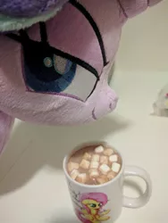Size: 510x680 | Tagged: photographer needed, safe, artist:bugplayer, derpibooru import, fluttershy, starlight glimmer, pony, unicorn, chocolate, cup, devious, empathy cocoa, evil planning in progress, female, food, hot chocolate, hot coco, irl, mare, marshmallow, marshmallows, mug, photo, plushie, pure unfiltered evil, smiling, smug, smuglight glimmer, solo