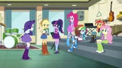 Size: 1912x1072 | Tagged: safe, derpibooru import, screencap, applejack, fluttershy, pinkie pie, rainbow dash, rarity, sci-twi, spike, spike the regular dog, sunset shimmer, twilight sparkle, dog, dance magic, equestria girls, spoiler:eqg specials, angry, belt, boots, canterlot high, clothes, compression shorts, cowboy hat, cymbals, denim skirt, drum kit, drums, female, freckles, glasses, group, guitar, hand on hip, hat, high heel boots, humane five, humane seven, humane six, keyboard, maracas, mary janes, musical instrument, ponytail, saxophone, shoes, shorts, sitting, skirt, socks, stairs, stetson, striped socks, tambourine, triangle, xylophone