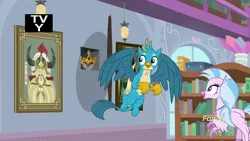 Size: 1920x1080 | Tagged: safe, derpibooru import, screencap, gallus, silverstream, yickslur, classical hippogriff, gryphon, hippogriff, a matter of principals, bookshelf, bust, crown, crown of grover, duo, female, helmet, helm of yickslur, jewelry, library, male, portrait, regalia, tv rating, tv-y