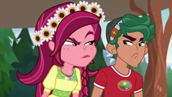 Size: 1280x720 | Tagged: safe, derpibooru import, screencap, gloriosa daisy, timber spruce, equestria girls, legend of everfree, angry, camp everfree logo, camp everfree outfits, clothes, faic, female, flower, flower in hair, geode of fauna, geode of shielding, geode of sugar bombs, geode of super speed, geode of super strength, magical geodes, male, timber spruce is not amused