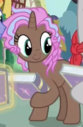 Size: 395x606 | Tagged: safe, derpibooru import, screencap, cocoa candy, pony, unicorn, fame and misfortune, background pony, book, cropped, female, friendship journal, mare, solo