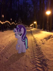 Size: 2448x3264 | Tagged: safe, artist:albertuha, derpibooru import, starlight glimmer, pony, unicorn, female, frown, irl, mare, night, photo, ponies in real life, raised hoof, smiling, snow, solo, winter
