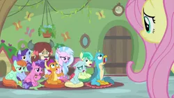 Size: 1280x720 | Tagged: safe, derpibooru import, screencap, berry blend, berry bliss, fluttershy, gallus, november rain, ocellus, peppermint goldylinks, sandbar, silverstream, smolder, yona, changedling, changeling, classical hippogriff, dragon, earth pony, gryphon, hippogriff, pegasus, pony, unicorn, yak, teacher of the month (episode), spoiler:interseason shorts, bow, classroom, cloven hooves, colored hooves, dragoness, female, friendship student, hair bow, jewelry, male, mare, monkey swings, necklace, stallion, teenager