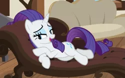 Size: 763x479 | Tagged: safe, derpibooru import, screencap, rarity, pony, unicorn, it isn't the mane thing about you, cropped, draw me like one of your french girls, fainting couch, female, lidded eyes, lying down, mare, open mouth, sitting, smiling, solo