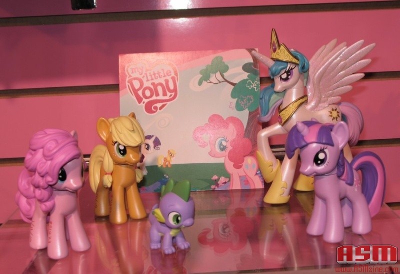 Size: 800x549 | Tagged: safe, derpibooru import, applejack, pinkie pie, princess celestia, rarity, spike, twilight sparkle, alicorn, dragon, earth pony, pony, unicorn, 2010, 2010 asm toy fair, asm toy fair, female, hatless, irl, it begins, male, mare, missing accessory, my little pony logo, photo, pony history, prototype, start of ponies, toy, toy fair