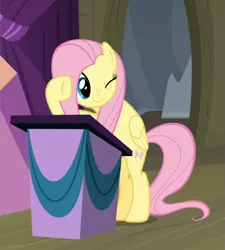 Size: 803x892 | Tagged: safe, derpibooru import, screencap, fluttershy, pegasus, pony, horse play, bipedal, cropped, cute, female, lectern, mare, one eye closed, podium, raised hoof, shyabetes, smiling, wink