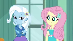 Size: 1920x1080 | Tagged: safe, derpibooru import, screencap, fluttershy, trixie, butterfly, a little birdie told me, equestria girls, equestria girls series, angry, annoyed, barrette, canterlot high, classroom, clothes, crossed arms, cute, dress, duo, female, frown, geode of fauna, hairclip, hoodie, looking at each other, madorable, magical geodes, pouting, raised eyebrow, rivalry, skirt, standoff, stars, window