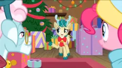 Size: 1136x640 | Tagged: safe, derpibooru import, screencap, alice the reindeer, aurora the reindeer, pinkie pie, deer, pony, reindeer, best gift ever, needs more jpeg, present, tree