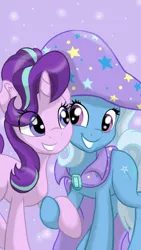 Size: 3072x5461 | Tagged: safe, artist:theroyalprincesses, derpibooru import, starlight glimmer, trixie, pony, unicorn, best friends, cape, clothes, cute, diatrixes, eye clipping through hair, female, glimmerbetes, hat, holding hooves, looking at each other, mare, raised hoof, smiling, trixie's cape, trixie's hat