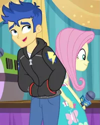 Size: 787x987 | Tagged: safe, derpibooru import, screencap, flash sentry, fluttershy, best in show: the pre-show, equestria girls, equestria girls series, spoiler:eqg series (season 2), clothes, cropped, female, hands in pockets, hoodie, male, microphone, pants, smiling