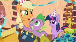 Size: 1669x941 | Tagged: safe, derpibooru import, screencap, applejack, spike, twilight sparkle, dragon, earth pony, pony, unicorn, secret of my excess, book, fangs, female, flower, freckles, golden oaks library, hat, hug, ladder, looking at each other, male, mare, party hat, smiling, unicorn twilight