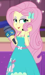 Size: 534x898 | Tagged: safe, derpibooru import, screencap, fluttershy, best in show: the victory lap, equestria girls, equestria girls series, spoiler:eqg series (season 2), beautiful, best in show logo, clothes, cropped, cute, dress, eyeshadow, geode of fauna, lidded eyes, magical geodes, makeup, microphone, playing with hair, shyabetes, solo