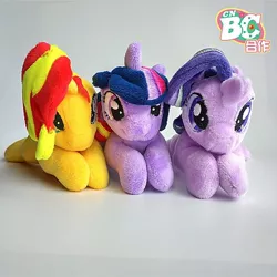 Size: 640x640 | Tagged: safe, derpibooru import, starlight glimmer, sunset shimmer, twilight sparkle, pony, unicorn, china ponycon, female, irl, lying down, magical trio, mare, photo, plushie, smiling