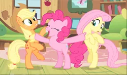 Size: 1594x941 | Tagged: safe, derpibooru import, screencap, applejack, fluttershy, pinkie pie, earth pony, pegasus, pony, bats!, apple, applejack's hat, bipedal, cowboy hat, cropped, eyes closed, fake fangs, fangs, female, food, freckles, hat, mare, open mouth, pushing, raised hoof, raised leg