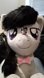 Size: 1836x3264 | Tagged: safe, artist:qtpony, artist:tinyequine, derpibooru import, octavia melody, pony, bowtie, cute, irl, looking at you, macro, micro, photo, plushie, self ponidox, size difference, tavibetes, tongue out