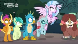 Size: 1920x1080 | Tagged: safe, derpibooru import, screencap, gallus, ocellus, sandbar, silverstream, smolder, yona, changedling, changeling, classical hippogriff, dragon, earth pony, gryphon, hippogriff, pony, yak, uprooted, bow, cloven hooves, colored hooves, dragoness, female, hair bow, jewelry, male, monkey swings, necklace, reaction image, student six, teenager